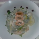Cilindro di triglie con emulsione di tonno e paté di tartufo nero su carpaccio di baccalà e rucola